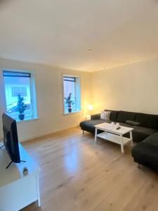 a living room with a couch and a table at 144Nygårdsvej (id.168) in Esbjerg