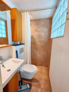 a bathroom with a toilet and a sink at 144Nygårdsvej (id.168) in Esbjerg