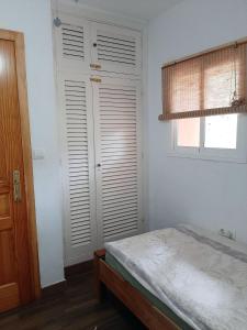 Łóżko lub łóżka w pokoju w obiekcie Tarifa-Blick auf Afrika, Haus am Meer, Haustiere erlaubt