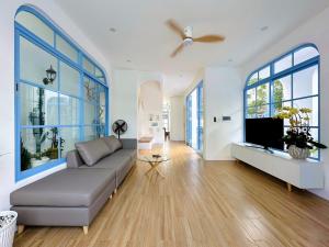 a living room with a couch and a flat screen tv at Serena Villa, Da Nang, Viet Nam, 3 bedrooms - Vietnam in Danang