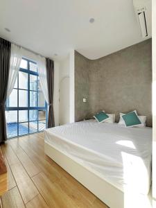 a bedroom with a large bed and a large window at Serena Villa, Da Nang, Viet Nam, 3 bedrooms - Vietnam in Da Nang
