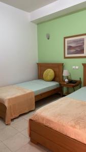 Postel nebo postele na pokoji v ubytování Felicidade Hotel