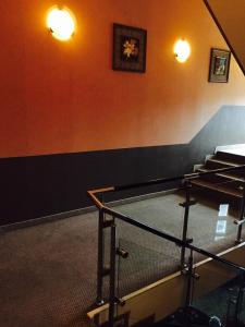 an empty courtroom with two lights on the wall at Matrix Hotel in Tecuci