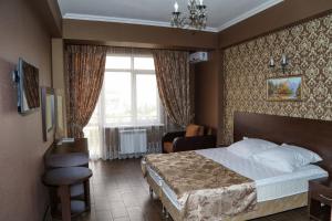 Postel nebo postele na pokoji v ubytování Antika Hotel