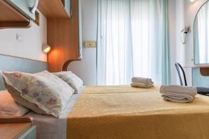 Postel nebo postele na pokoji v ubytování Hotel Atlantic