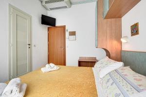 Postel nebo postele na pokoji v ubytování Hotel Atlantic