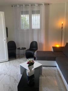 a living room with a couch and a table at DiaMar in Kallithea Halkidikis +40 photos