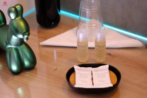 a table with two bottles on top of a table at Ama Casa Siracusa in Siracusa