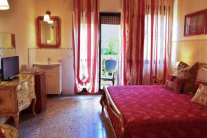 a bedroom with a bed and a bathroom with a sink at Venice Lion Residence - Vespucci in Mestre