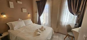 Postel nebo postele na pokoji v ubytování Hotel Diana