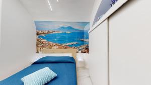 a bedroom with a wall mural of a city at Vesuvius Home in Naples