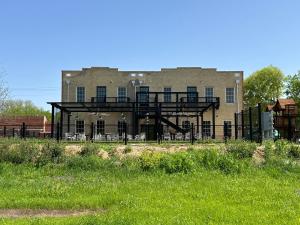 a large building with a balcony in front of it at Western 1924 Luxury Lofts in Martindale