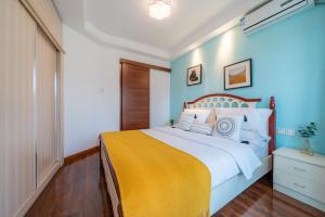 Ένα ή περισσότερα κρεβάτια σε δωμάτιο στο Yue Ke Apartment - Changbin Road Branch
