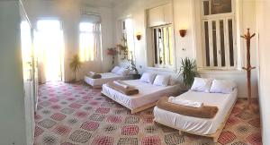 a living room with two beds and a couch at Alam B&B Luxor in Luxor