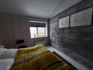 Ένα ή περισσότερα κρεβάτια σε δωμάτιο στο Guesthouse Nýp