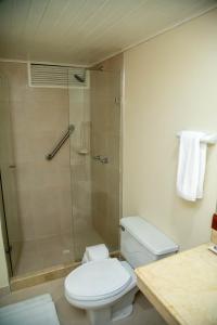 a bathroom with a toilet and a shower at Hotel Bahia Cartagena in Cartagena de Indias