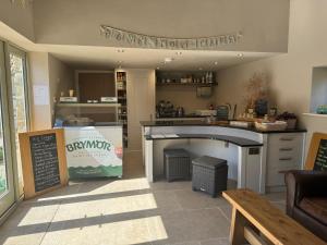 a kitchen with a counter and a table in a room at Bank Top Barn Double Bedroom Self-catering 2 guests in Pickering +4 photos