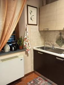 Η κουζίνα ή μικρή κουζίνα στο Casa Vacanze Rustico Di Corte