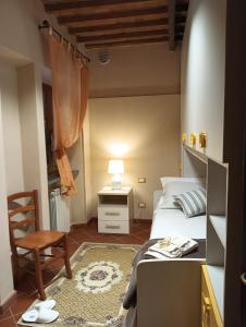 Ένα ή περισσότερα κρεβάτια σε δωμάτιο στο Casa Vacanze Rustico Di Corte