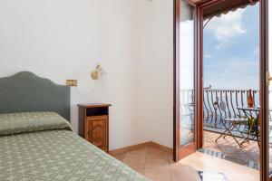 Ένα ή περισσότερα κρεβάτια σε δωμάτιο στο Villa Lavinia Nocelle