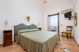 Ένα ή περισσότερα κρεβάτια σε δωμάτιο στο Villa Lavinia Nocelle