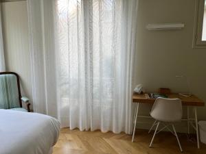 Posteľ alebo postele v izbe v ubytovaní La Villa d'Auteuil, Paris 16, rénovée