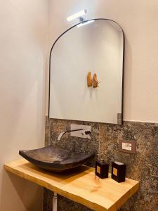 a bathroom with a sink and a mirror at B&B Al Castello Sweethome in Parma