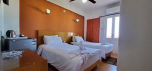 Letto o letti in una camera di Adriatica Hotel Marsa Matrouh
