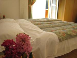 Postel nebo postele na pokoji v ubytování Garni B&B Mozart Nesthouse