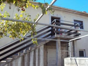 a building with stairs in front of a building at Seaside Apartment Bubi in Crikvenica