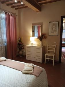Ένα ή περισσότερα κρεβάτια σε δωμάτιο στο Casa Vacanze Rustico Di Corte