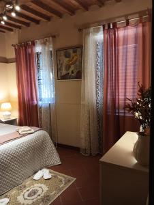 Ένα ή περισσότερα κρεβάτια σε δωμάτιο στο Casa Vacanze Rustico Di Corte