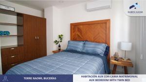 Una cama o camas en una habitación de Hermoso Departamento Vista Al Mar