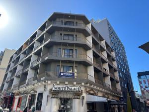 a building with a winter market sign in front of it at Paceville Apartments in St Julian's