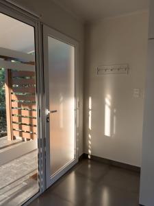 an empty room with a sliding glass door at Casa Country Altos Arrayanes in Mercedes