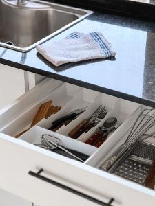 a drawer in a kitchen with utensils at Casa Country Altos Arrayanes in Mercedes