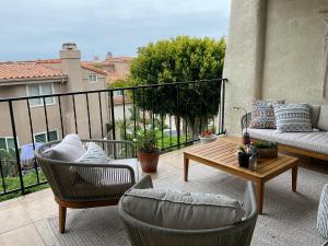 a patio with chairs and a table on a balcony at Condo in Dana Point in Dana Point