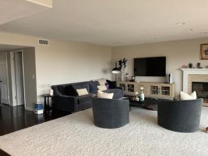 a living room with a couch and a tv at Condo in Dana Point in Dana Point