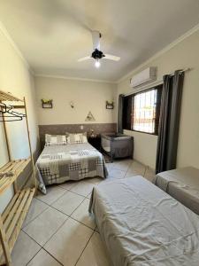 Un pat sau paturi într-o cameră la Sobrado 4 quartos - c/ piscina e churrasqueira