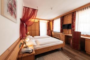 Postel nebo postele na pokoji v ubytování Hotel Goldene Rose