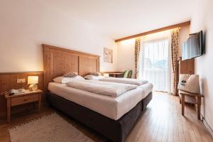 Postel nebo postele na pokoji v ubytování Hotel Goldene Rose
