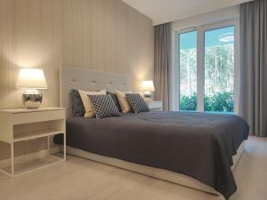 En eller flere senge i et værelse på SandLand - Rogowo Pearl + 121 billeder