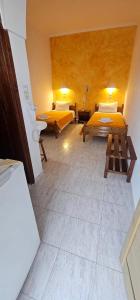 Ліжко або ліжка в номері Hotel Palladion