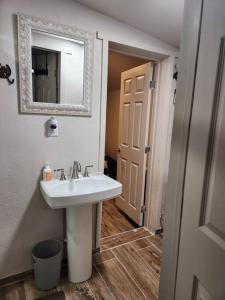 a bathroom with a sink and a mirror at Western Tinyhouse, Ready For Summer Fun! in Apache Junction +38 photos