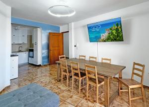 a kitchen and dining room with a table and chairs at SeaBreeze - Torre San Giovanni in Torre San Giovanni Ugento