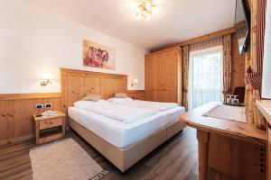 Postel nebo postele na pokoji v ubytování Hotel Goldene Rose