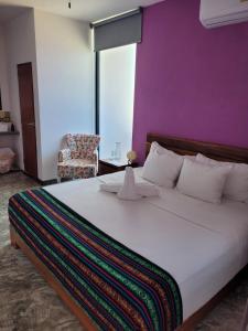 Postel nebo postele na pokoji v ubytování Itza Hotel Akumal