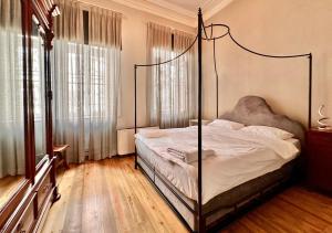 a bedroom with a bed with a metal frame at Private Central 2BR/2BA House w Patio&Terrace in Konak