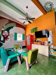 a play room with chairs and a soda machine at La Viduka Hostel in Cartagena de Indias