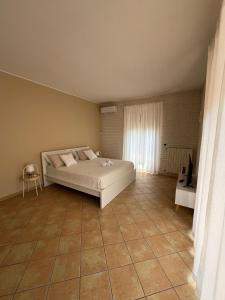 เตียงในห้องที่ Villa Maria Palese